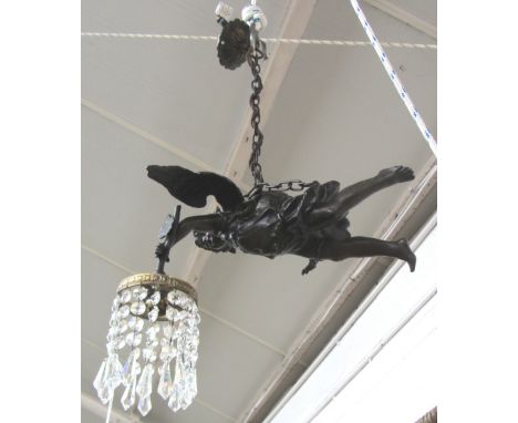 A patinated spelter figural ceiling light, early 20th century, modelled as a winged angel with crystal drops suspended from t