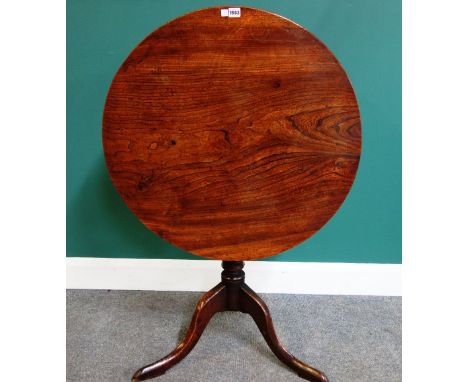 A mid-18th occasional table, the circular elm snap top on tripod base, 75cm wide.