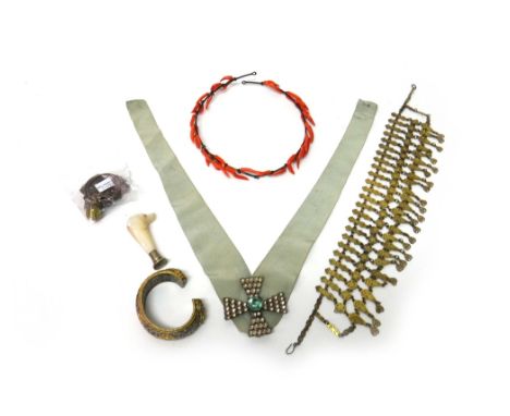 A coral tiara, a pale blue and colourless paste cruciform brooch, a pale blue paste set bangle, a gilt metal necklace, a carv