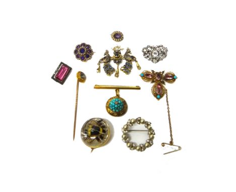 A gold, amethyst and seed pearl set shaped circular brooch, a colourless paste set brooch, a reverse painted intaglio crystal