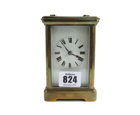 A French brass cased carriage clock, early 20th century, with white enamel dial, visible escapement and two train movement, w