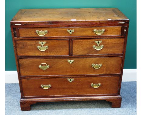 A George III mahogany bachelor's chest, the fold over top above one long and two short and two further long drawers, on brack