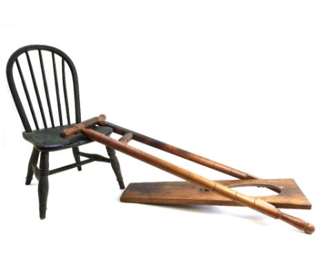 A 19th century painted child's stick back chair, together with a beech and oak boot jack with turned decoration (2).