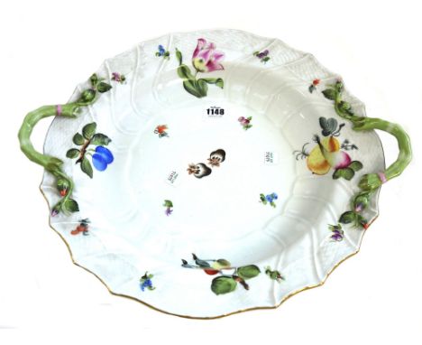 A Herend porcelain part dinner service decorated in the `Fruits and Flowers' pattern comprising; a circular two handled dish 