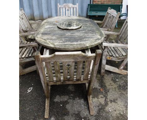 Forge Products, Hutton-Le-Hole, North Yorkshire; a hardwood oval garden table, 124cm wide x 196cm long, together with six mat