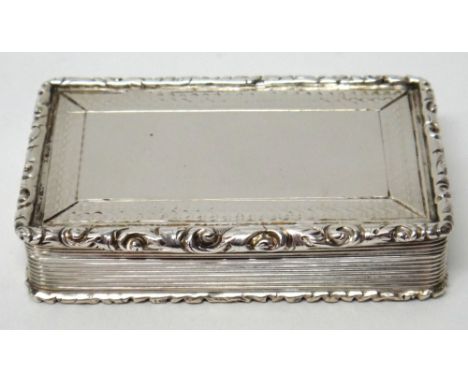 A Victorian silver rectangular snuff box, decorated to the borders of the lid and to the base, with engine turning within scr