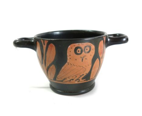 An attic red figured owl skyphos of two handled form, circa 5th-4th century B.C., decorated each side with an owl flanked by 