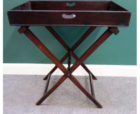 A George III and later mahogany butler's tray on folding X-frame stand, 75cm wide; together with a George II style parcel gil