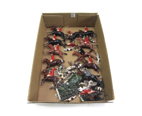 A quantity of Britains hollow cast lead figures, from the Hunting series, including mounted riders, hounds and a fox (qty).