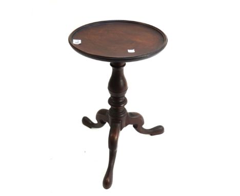 A 19th century mahogany tripod kettle stand, of 18th century style, with dished circular top and baluster framed column, 46cm