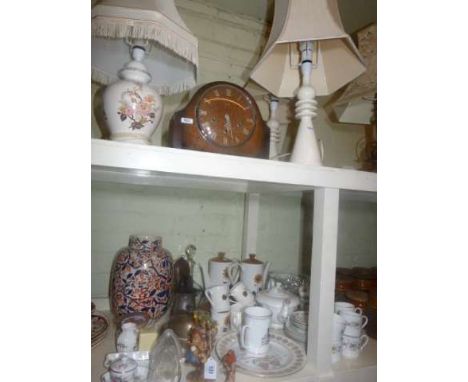 Four table lamps, oak mantel clock, Royal Doulton 'Pastorale' and other teaware, two powder flasks, two Hummel figures, pictu