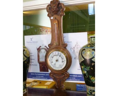 Carved oak aneroid barometer
