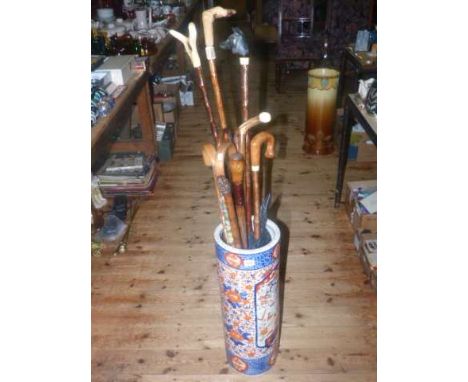 Imari design pottery stick stand and collection of sticks