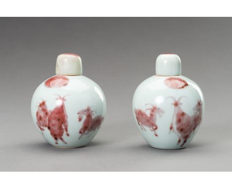 A RARE PAIR OF COPPER-RED, LIDDED PORCELAIN JARLETS DEPICTING GOATS, 1900sChina, late Qing dynasty (1644-1912) - Republic per