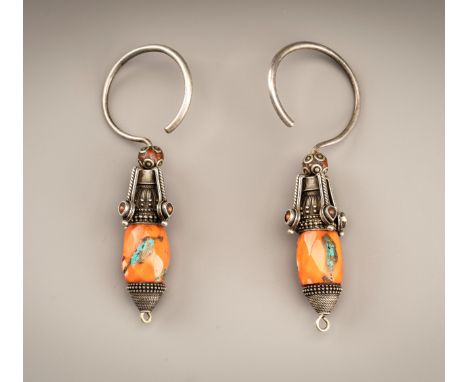 A PAIR OF CORAL AND TURQUOISE SET METAL EARRINGS, c. 1880sTibet, late 19th century. Each having an upper section crafted from