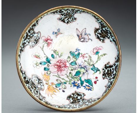A CANTON ENAMEL 'FLOWERS AND BUTTERFLIES' DISH, QINGChina, Qing Dynasty (1644-1912). Painted in vibrant colors with a lobed m