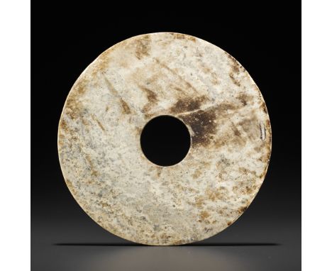 A JADE BI DISC, LIANGZHUJade. China, Liangzhu culture, c. 3300-2200 BCThe opaque stone with calcification and of a grayish-be