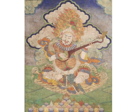 A THANGKA OF DHRITARASHTRA, QING DYNASTY 清代持國天王唐卡Sino-Tibetan, 19th century. Distemper on linen. The leader of the Gandharva 