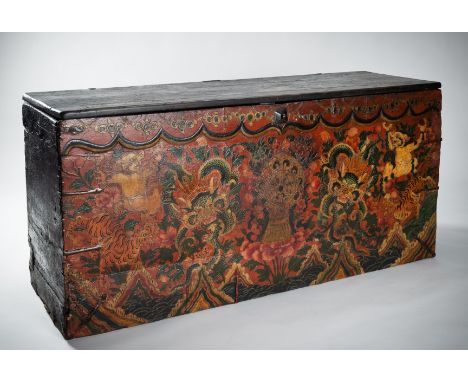 A LARGE TIBETAN WOOD STORAGE TRUNK, 19th CENTURYTibet, 19th century. The large wood storage trunk with a hinged lid, the fron
