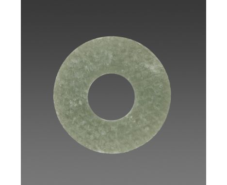 A JADE BI DISC, EASTERN ZHOU TO WESTERN HANJade. China, Late Eastern Zhou - Early Western Han, 4th-3rd century BCThe jade of 