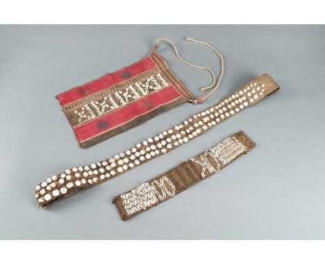 LOT WITH TWO TRIBAL NAGALAND SHELL STUDDED BELTS AND AN APRON, c. 1900sNagaland, India/Burma, early 20th century. Comprising 
