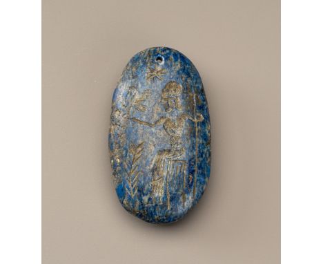 A BACTRIAN LAPIS LAZULI INTAGLIO TALISMAN WITH A FIGUREPresumably ancient region of Bactria, c. 2500 years old. Of flattened 