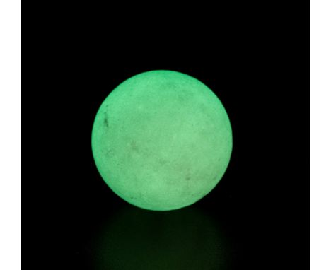 A 'GLOWING IN THE DARK' STONE SPHEREOf near perfect spherical form, it can easily absorb light (both sunlight and artificial)