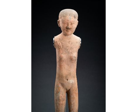 A RARE POTTERY FIGURE OF A FEMALE, WESTERN HANChina, Western Han Dynasty (206 BC-8 AD). A rare female figure, which correspon