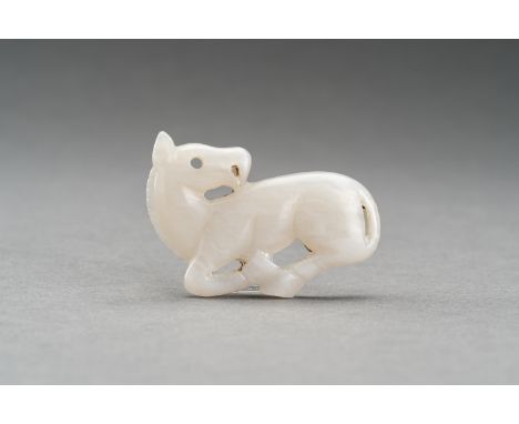 A GRAY JADE PENDANT OF A RECUMBENT HORSE, c. 1920sChina, late Qing Dynasty (1644-1912) to Republic period (1912-1949). Well c