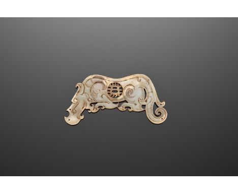 A WHITE JADE 'DRAGON' PENDANT, HAN DYNASTYJade. China, Han dynasty, 2nd century BC to 2nd century ADThe flattened pendant is 