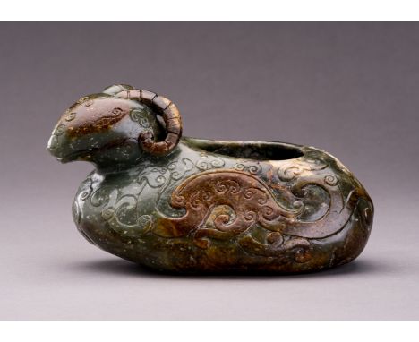 AN ARCHAISTIC SPINACH GREEN AND RUSSET JADE 'RAM' VESSELChina, Republic period (1912-1949) or later. The vessel of organic fo