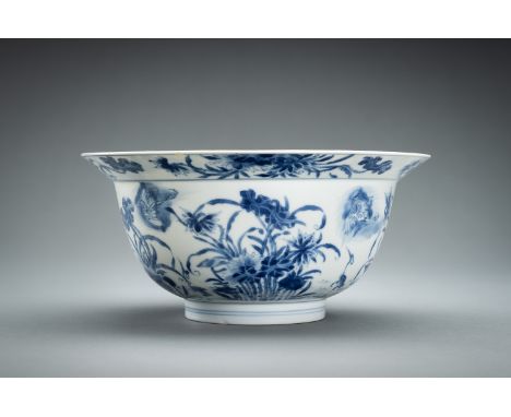 A BLUE AND WHITE PORCELAIN 'FLOWERS AND CRANES' BOWL, KANGXIChina, Kangxi period (1662-1722). The deep rounded sides rising f
