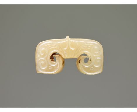 A SMALL JADE 'BIRDS' PENDANTJade. China, late Western Zhou to early Eastern Zhou, 8th-6th century BCFinely carved as a pair o