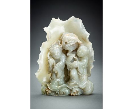 A CELADON JADE Â´HEHE ERXIANÂ´ GROUP, c. 1920sChina, late Qing Dynasty (1644-1912) - Republic period (1912-1949). The twin im