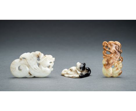 A LOT WITH THREE JADE PENDANTS, QINGChina, Qing Dynasty (1644-1912). The first carved as a winged beast, the s-shaped body te