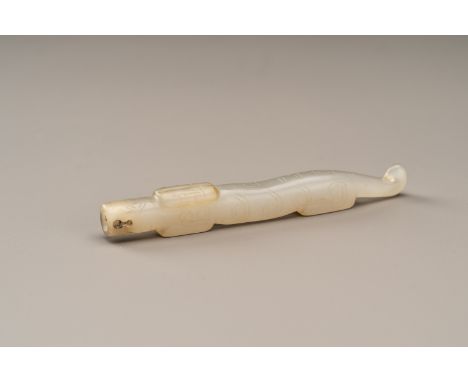 AN ARCHAISTIC HAN STYLE GRAY GLASS 'IMITATION JADE' CHILONG PENDANTChina, Qing Dynasty (1644-1912). Crafted in the style of t