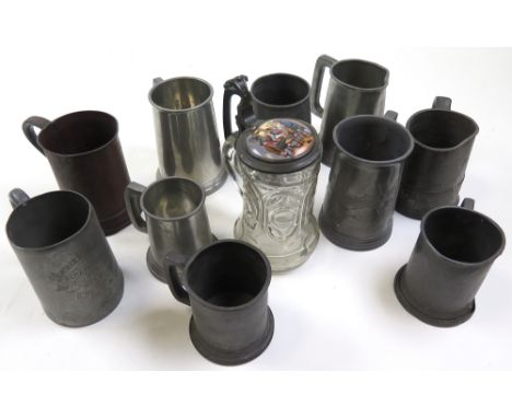 Collection of eleven tankards mostly pewter, including a moulded glass tankard with enamel pewter lid