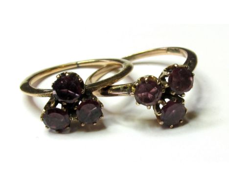 9ct/Yellow metal identical 3 stone Amethyst Rings sizes L & J weight 3.9 grams 