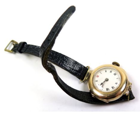 9ct Gold Ladies wristwatch the 15 jewel movement by Rolex, the white enamel dial with outside minute track and red 12. Hallma