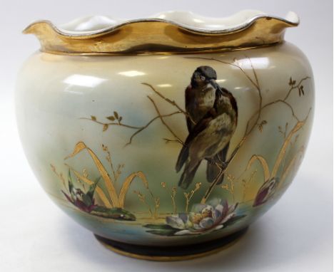 Large ceramic jardiniere depicting a pair of reed warblers sitting on a branch above lily pads, with gilt decoration, marked 