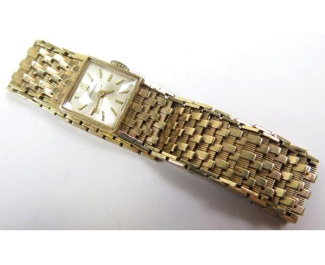 Ladies 9ct gold Longines wristwatch, square silvered dial with gilt batons. The gold bracelet with ladder snap clasp. total w