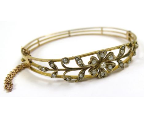 9ct Gold Hinged Bangle floral pattern set with Seed Pearls weight 10.1 grams