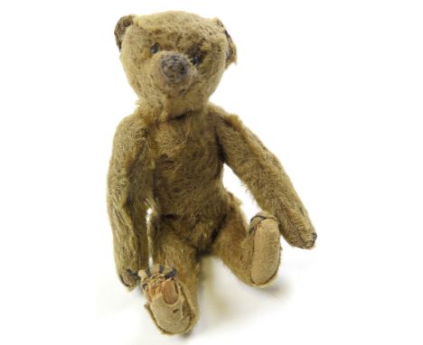 Early Steiff Teddy Bear, c. 1910's, button in ear present, some loss to fur, wear to lower right paw, 17.5cm tall approx.