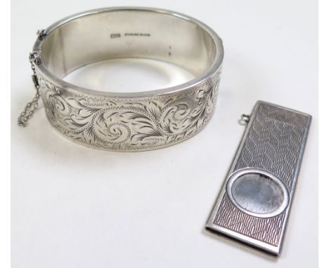 Modern Silver Cigar cutter (hallmarked Birmingham 1976) along with a silver bangle (hallmarked Birmingham 1960)