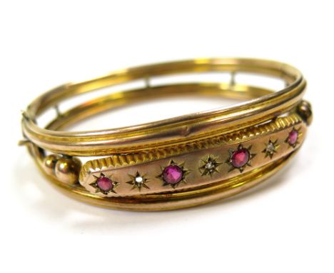 9ct Gold Bangle set with Rubies and Diamonds (small Diamond missing) weight 10.1 grams