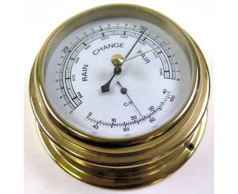 A modern brass barometer, made in Germany, approx diameter of dial 9.5cm