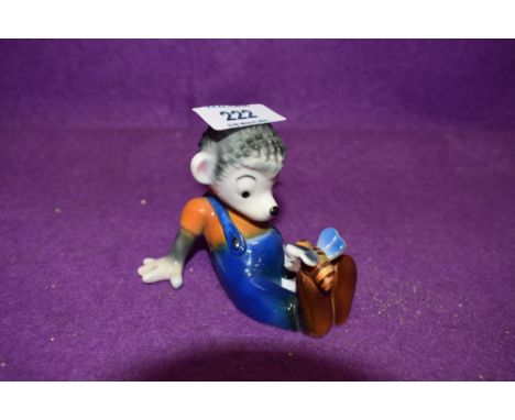 A mid century pottery figure by Goebel hedgehog sat with butterfly