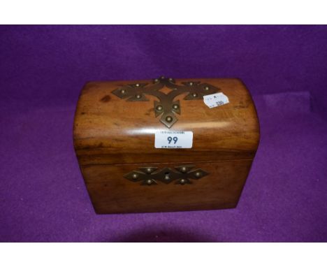 An antique treasure chest design tea caddy having tiger stripped case with brass detailing compartment lids and case in good 