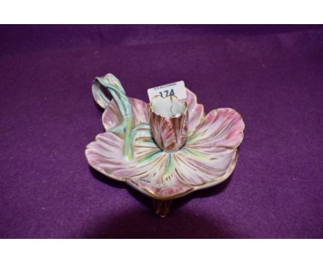 An antique chamber stick in the form of a lotus style flower hard paste body bearing Meissen crossed swords to base