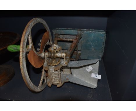 A vintage cast salesman model replica of a cake breaker marked BSO Goraya